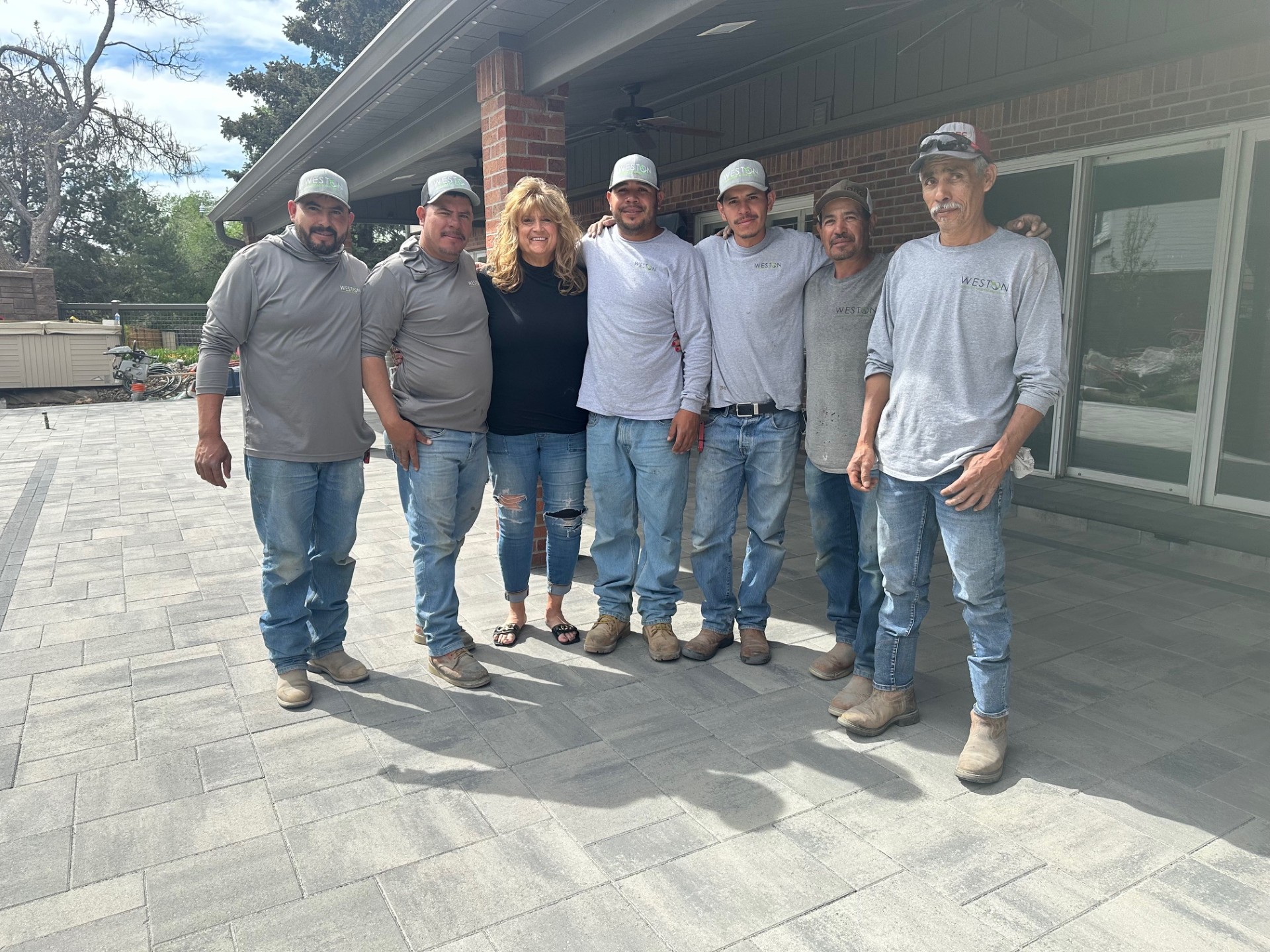 Weston Landscape & Design team members on a completed project